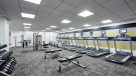 large fitness center with treadmills and elliptical machines